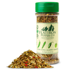 Flatiron Spice Hatch Green Chile Flakes being poured, showcasing vibrant color and heat.