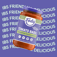 Fody Tomato Basil Pasta Sauce with fresh basil leaves close-up