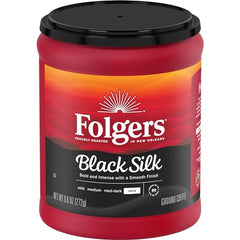 Ground coffee pours into a French press, showing versatile brewing with Folgers Black Silk.