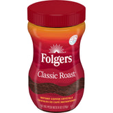 Folgers Classic Roast Instant Coffee jar on a kitchen counter for quick brewing.