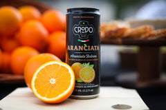 Fonti Di Crodo Aranciata glass sparkle, shows real orange pulp texture.