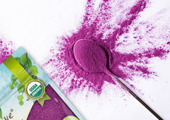 Food to Live powder being poured into batter to color recipes.