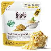 Foods Alive Nutritional Yeast Flakes bottle adds cheesy, dairy-free flavor to meals.
