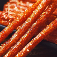 Fraunitsh spicy latiao strips texture close-up, juicy chew.