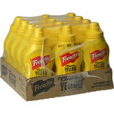 French's Classic Yellow Mustard squeeze bottle pouring on a hot dog for bold flavor