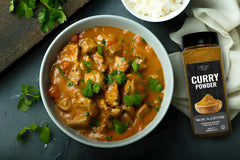 Fresh Finest curry powder jar closeup highlights authentic spice blend.