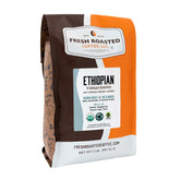 Fresh Roasted Coffee Ethiopian Yirgacheffe package shows organic and fair trade labels.