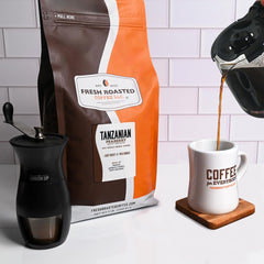 Fresh Roasted Coffee Tanzanian Peaberry light roast annotation on bag.