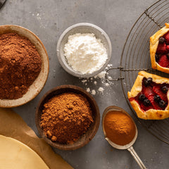 Frontier Co-op corn starch powder is measured into a spoon for sauces.