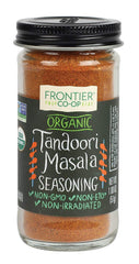 Frontier Co-op Tandoori Masala seasoning bottle pour, ideal for grilling and marinades.