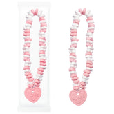 Fruidles Valentines stretchable heart candy in pastel pink and yellow for playful party favors.