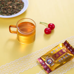 FullChea Liver Detox Tea steeped cup with warm red infusion.