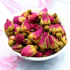 FullChea rose buds tea in cup, aromatic and edible.