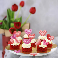 Fyeoxle heart toppers on a cupcake add festive flair.