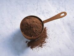 Ghirardelli hot chocolate preparation using cocoa powder for rich flavor.