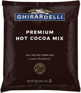 Ghirardelli hot cocoa mix in a steaming mug for cozy indulgence.