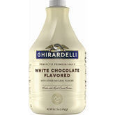 Ghirardelli white sauce bottle pour showing creamy texture for beverages
