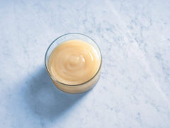 Ghirardelli white chocolate sauce enhances coffee flavor and aroma in espresso