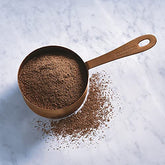 Ghirardelli Sweet Ground Chocolate Powder package with rich aroma, ideal for beverages and desserts.