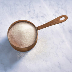 Ghirardelli Sweet Ground White Chocolate Beverage Mix package ready for espresso and milk.