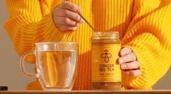 Spoon dispensing concentrate into mug for a quick, naturally sweet drink