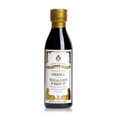 Giusti balsamic glaze bottle close-up highlighting authentic Modena IGP provenance for refined Italian flavor