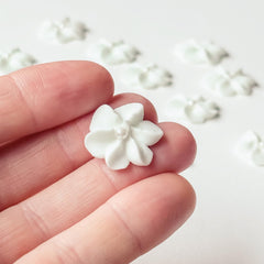 Global Sugar Art mini royal icing flowers in white with pearls for elegant wedding cupcakes.