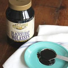 Golden Barrel Black Strap Molasses bottle with strong flavor for hearty baked goods.