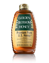 Golden Blossom pure honey bottle pour for tea and toast.