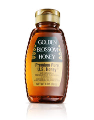 Close-up of Golden Blossom Honey texture with rich amber color.