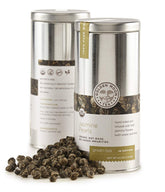 Golden Moon Tea Jasmine Dragon Pearls packaging preserves aroma in travel tin.