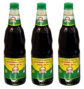 Golden Mountain Seasoning Sauce bottle on the kitchen counter boosts stir-fry flavor.