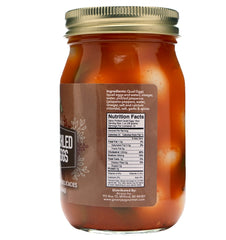 Green Jay Gourmet spicy pickled quail eggs on a charcuterie board add bold heat