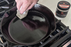 GriddleMATe cast-iron pan sealed image illustrating protective coating