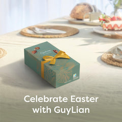 GuyLian hazelnut praline truffles with white and milk marbled shells, premium indulgence.