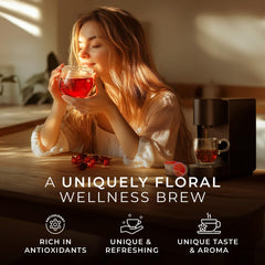 Gya Tea Co hibiscus tea pour into a ceramic mug with vibrant infusion