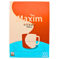 Haitai Maxim Supreme Gold Coffee packaging box on kitchen shelf.