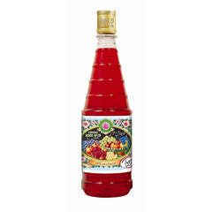 Hamdard Rooh Afza rose syrup being poured into a glass.