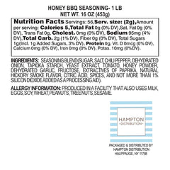 Close-up of Hampton Distribution Honey BBQ Seasoning being sprinkled on grilled chicken.