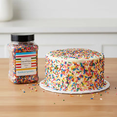 Cupcakes topped with The Hampton Rainbow Sprinkles for a celebratory, colorful finish.