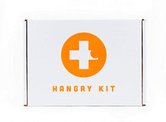 Hangry Kit Mega Care Pack snacks layout showcases twenty diverse treats for on-the-go snacking.