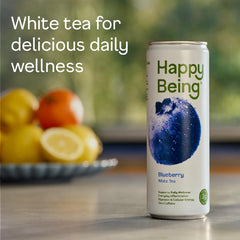 Happy Being Blueberry White Tea glass featuring turmeric and elderberry infusion.