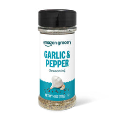 Happy Belly Black Garlic Pepper jar on a wooden board elevates weeknight flavor