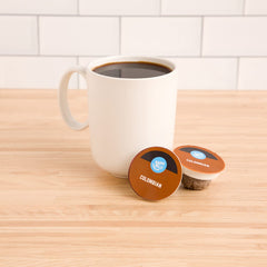 Happy Belly compostable coffee pods shown for eco-friendly brewing.