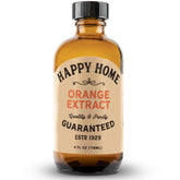 Happy Home Orange Extract bottle close-up showing vibrant citrus flavor for baking.