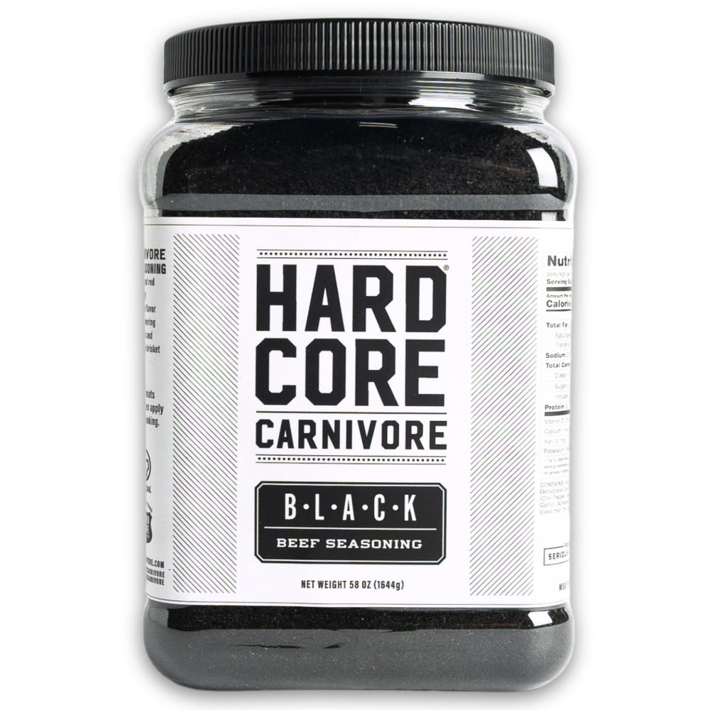 Hardcore Carnivore Black activated charcoal rub bottle close-up for rich beef flavor.