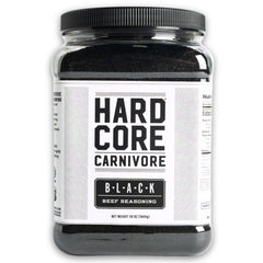 Hardcore Carnivore Black activated charcoal rub bottle close-up for rich beef flavor.