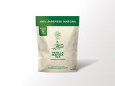 Harmony Proteins The Harmony Matcha Vanilla bag with steaming cup for a smooth, focused moment.
