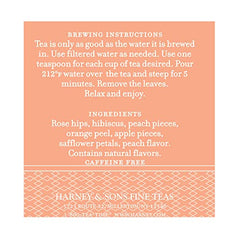 Harney & Sons Peach Fruit Tea rosehips-hibiscus close-up, vibrant ruby infusion ready to enjoy.