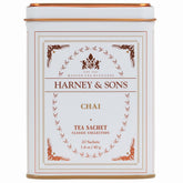 Harney & Sons chai spiced black tea sachets in a decorative tin for convenient brewing.